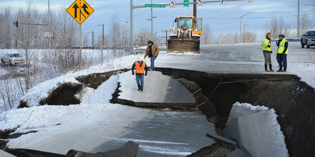 File - In this Nov. 30, 2018 file photo, workers inspect an off-ramp that collapsed during an earthquake in Anchorage, Alaska. Nearly three weeks after a magnitude 7.0 earthquake shook up south central Alaska, the state continues to register frequent aftershocks. Anchorage television station KTUU reports seismic sensors have registered nearly 5,000 aftershocks since the Nov. 30 earthquake. (AP Photo/Mike Dinneen, File)