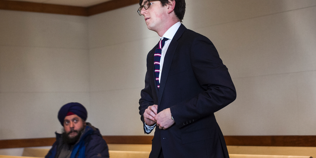 Owen Labrie arrives at Merrimack County Superior Court for his amended sentence hearing, Tuesday, Dec. 18, 2018, in Concord, N.H. A judge has refused to shorten the jail term for Labrie, a New Hampshire prep school graduate convicted of sexually assaulting a 15-year-old classmate in 2015, saying he has to report to jail for the remaining 10 months of his sentence the day after Christmas. (Geoff Forester/The Concord Monitor via AP, Pool)