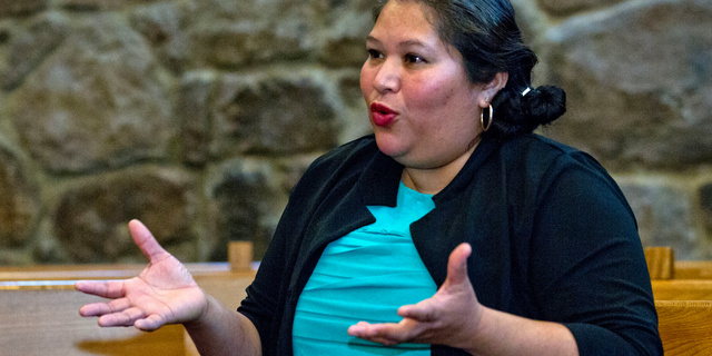 Undocumented Rosa Gutierrez Lopez of El Salvador speaks during an interview with The Associated Press after she sought sanctuary at Cedar Lane Unitarian Universalist Church in Bethesda Md., on Monday Dec. 17, 2018. Advocates say she is the first undocumented immigrant to take refuge at a Washington area house of worship. (AP Photo/Jose Luis Magana)