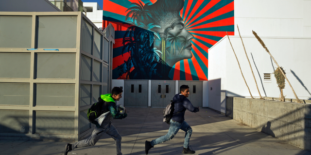 FILE - In this Dec. 13, 2018 file photo, a mural by artist Beau Stanton of actress Ava Gardner is displayed at the Robert F. Kennedy Community Schools complex school in Los Angeles. Artist Shepard Fairey will insist that one of his murals be removed from the Los Angeles school if officials follow through on plans to cover up Stanton's mural that some community activists find offensive, the Los Angeles Times reported Monday, Dec. 17, 2018. Both murals are in Koreatown at the Robert F. Kennedy Schools complex on the former site of the Ambassador Hotel where Kennedy was fatally shot in 1968. Stanton's mural depicts actress Ava Gardner against sun rays. Korean activists say it looks like the Japanese imperial battle flag. (AP Photo/Damian Dovarganes, File)