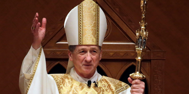 FILE - In this Nov. 18, 2014, file photo, Archbishop Blase Cupich acknowledges after the retiring Cardinal Francis George presents the crozier the during his Installation Mass at Holy Name Cathedral in Chicago. Illinois Attorney General Lisa Madigan on Wednesday, Dec. 19, 2018, issued a blistering report about clergy sexual abuse, saying that Catholic dioceses in Illinois has not released the names of at least 500 clergy accused of sexually abusing children. Cupich in a statement said that although he regretted "our failures to address the scourge of clerical sexual abuse," the archdiocese has been a leader in dealing with the issue, including a policy since 2002 of reporting "all allegations of child sexual abuse to civil authorities." (AP Photo/Charles Rex Arbogast, Pool, File)