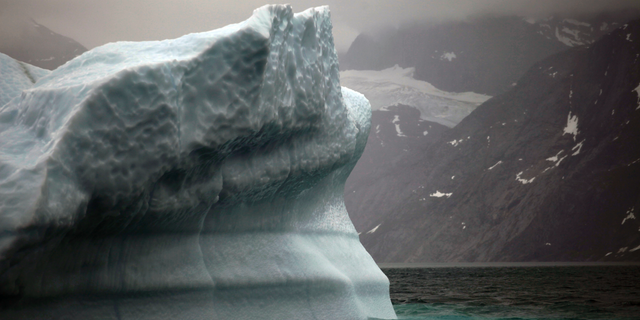 FILE- In this July 26, 2011 photo, a melting iceberg floats along a fjord leading away from the edge of the Greenland ice sheet near Nuuk, Greenland. Massive ice sheets in western Antarctica and Greenland are melting much faster than scientists figured a quarter century ago. Greenland has lost more than 5 trillion tons since 1992. International talks to fight global warming are set to start in Poland next week. (AP Photo/Brennan Linsley, File)
