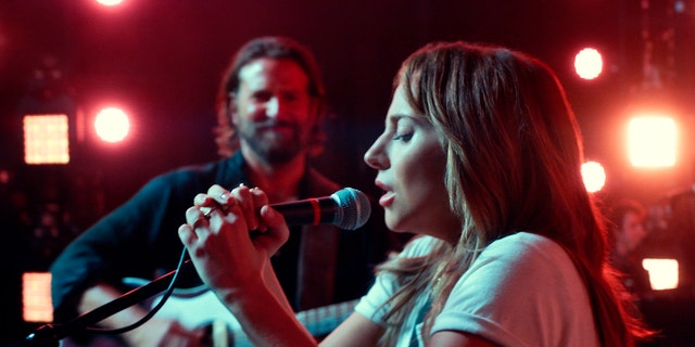  Bradley Cooper, left, and Lady Gaga in a scene from the latest reboot of the film, "A Star is Born."