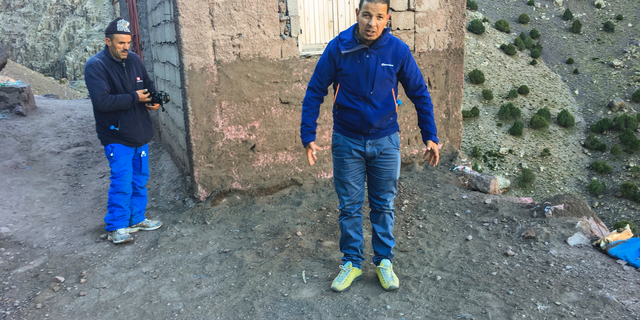 Tour guide Rachid shows the sight Thursday Dec. 20, 2018, where he says one of the women where found in the murder of two Scandinavian hikers whose bodies were found at a camp in Morocco's High Atlas mountains, about 10 Km (six miles) from the remote village of Imlil, Morocco. The victims found Monday Dec. 17, are confirmed as Maren Ueland from Norway and Louisa Vesterager Jespersen from Denmark, and four suspects have been detained in connection with the deaths. (Hege Pauline Hovig / NTB scanpix via AP)