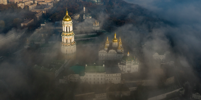 An aerial photo of the thousand-year-old Monastery of Caves, also known as Kiev Pechersk Lavra, the holiest site of Eastern Orthodox Christians is taken through morning fog during sunrise in Kiev, Ukraine, on Nov. 10, 2018.