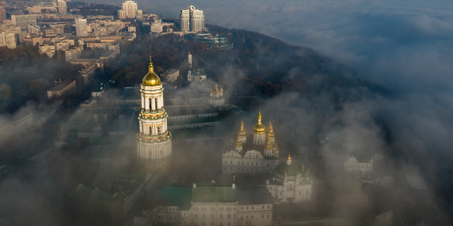 FILE - In this Saturday, Nov. 10, 2018 file photo, an aerial photo of the thousand-year-old Monastery of Caves, also known as Kiev Pechersk Lavra, the holiest site of Eastern Orthodox Christians is taken through morning fog during sunrise in Kiev, Ukraine.