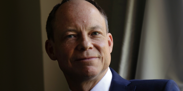 FILE - In this May 15, 2018 file photo, Judge Aaron Persky poses for photos in Los Altos Hills, Calif. Persky, the first California judge to be recalled in nearly a century is asking people to donate money so he can pay $135,000 in court-ordered attorney's fees to his victors' lawyer. (AP Photo/Jeff Chiu, File)