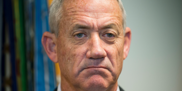 File - In this Thursday, Jan. 8, 2015 file photo, Israeli Defense Minister Benny Gantz pauses as he answers questions from members of the media during his meeting with Joint Chiefs Chairman Gen. Martin E. Dempsey, at the Pentagon. Gantz, former Israeli military chief, says he is running in the upcoming election. (AP Photo/Pablo Martinez Monsivais, File)