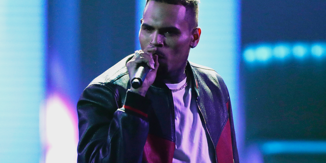FILE - In this June 25, 2017, file photo, Chris Brown performs at the BET Awards at the Microsoft Theater in Los Angeles. Brown released a 45-song album "Heartbreak on a Full Moon" on Tuesday, Oct. 31. Brown has been charged with monkey-related misdemeanors. The Los Angeles city attorney's office confirms Thursday, Dec. 27, 2018, that the 29-year-old singer was charged last week with two counts stemming from his possession of a pet capuchin monkey without a permit. (Photo by Matt Sayles/Invision/AP, File)