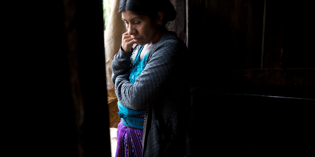 Catarina Alonzo Perez, mother of the second Guatemalan child this month to die while in U.S. custody, stands in her kitchen in Yalambojoch, Guatemala, Saturday, Dec. 29, 2018. Felipe was healthy when they left, according to the family. The last time he spoke with his mother was a day before they were taken into detention by border agents. Felipe told his mother that he was fine. (AP Photo/Moises Castillo)