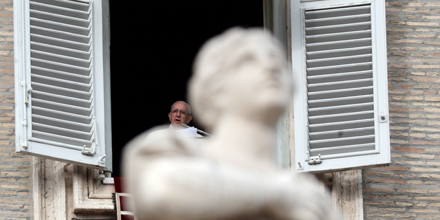 Pope Francis delivers his message during the Angelus noon prayer in St. Peter's Square, at the Vatican, Sunday, Dec. 16, 2018. (AP Photo/Gregorio Borgia)
