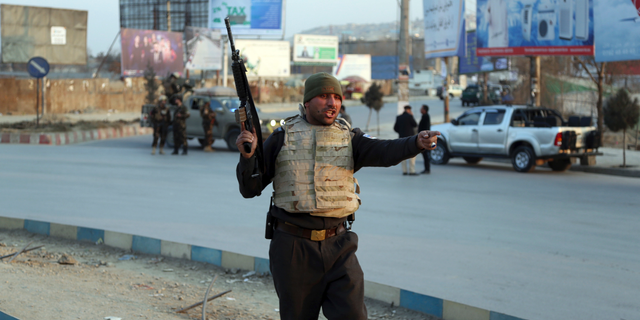 Afghan security forces arrive at the site of an explosion and attack by gunmen, in Kabul, Afghanistan, Monday, Dec. 24, 2018.