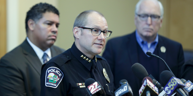 Sun Prairie Police Chief Patrick Anhalt, center, at a City Hall press conference Thursday Dec. 20, 2018, announcing the disposition of the July 10 explosion that leveled several buildings and killed a volunteer fire captain. The investigation concluded that no crime was committed. Dane County District Attorney Ismael Ozanne, is left, and State Assembly Rep. Gary Hebl is right. (Steve Apps/Wisconsin State Journal via AP)