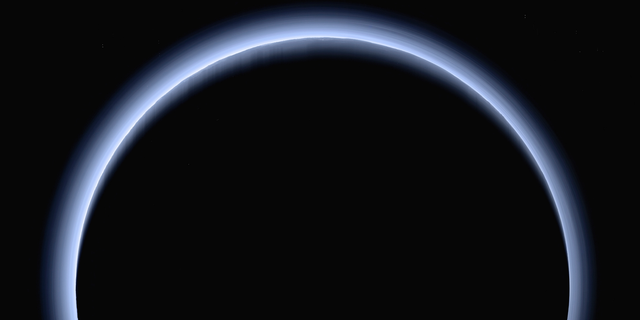 This image made available by NASA in March 2017 shows Pluto illuminated from behind by the sun as the New Horizons spacecraft travels away from it at a distance of about 120,000 miles (200,000 kilometers). The probe will ring in 2019 by exploring an even more distant and mysterious world. (NASA/Johns Hopkins University Applied Physics Laboratory/Southwest Research Institute via AP)