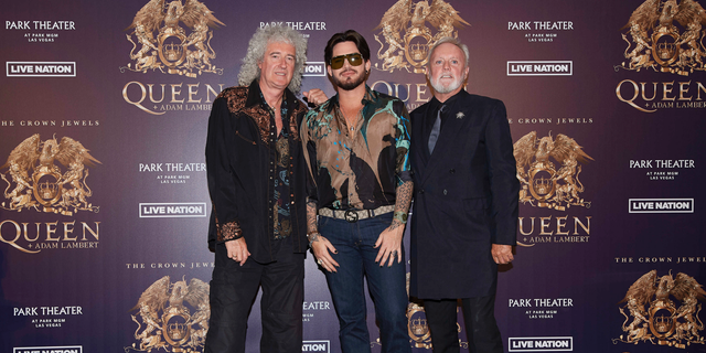 Brian May, from left, Adam Lambert, and Roger Taylor of Queen + Adam Lambert pose for a photo at the "The Crown Jewels" residency press conference at the MGM Resorts aviation hanger in Las Vegas. 
