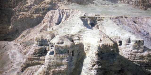 The caves near Qumran in the west edge of the Dead Sea, the place where the Dead Sea Scrolls were discovered. Dated 1950.