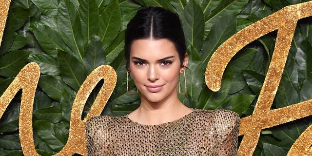 Kendall Jenner shared photos of herself romping around in the snow while wearing a bikini.