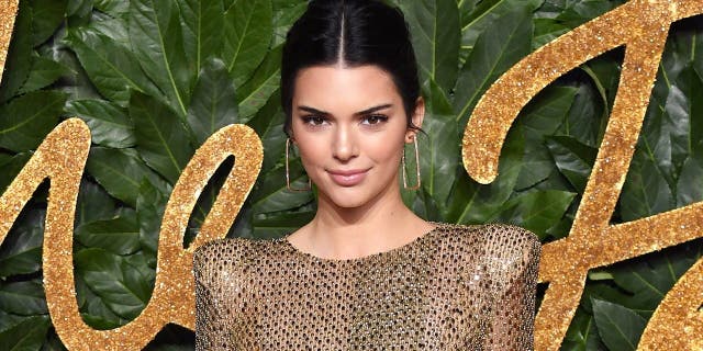 Kendall Jenner shared photos of herself romping around in the snow while wearing a bikini.