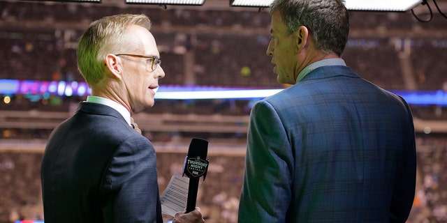 This Oct. 11, 2018, file photo shows Troy Aikman, right, and Joe Buck working before an NFL football game between the New York Giants and the Philadelphia Eagles in East Rutherford, N.J. (Associated Press)