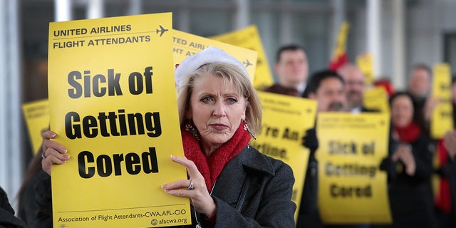 Members of the Association of Flight Attendants-CWA protest United Airlines at O'Hare International Airport on Dec. 13, 2018 in Chicago. (Photo by Scott Olson/Getty Images)