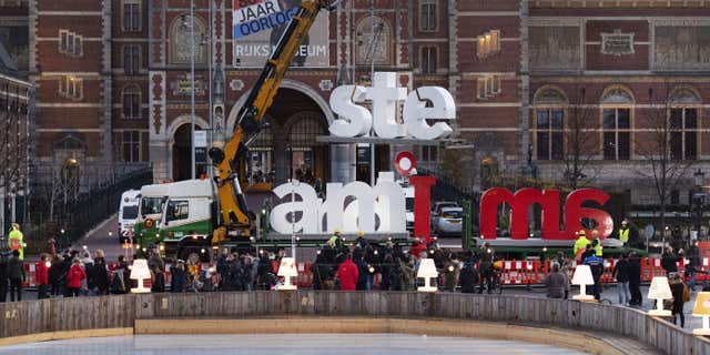 The red and white letters "I Amsterdam" are removed from the Museumplein (Museum Square) in Amsterdam, on Dec. 3, 2018.