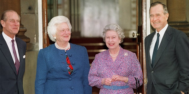 Queen Elizabeth II and Prince Philip pose with late President George H.W. Bush and his wife Barbara Nov. 30, 1993 at a private lunch in London.
