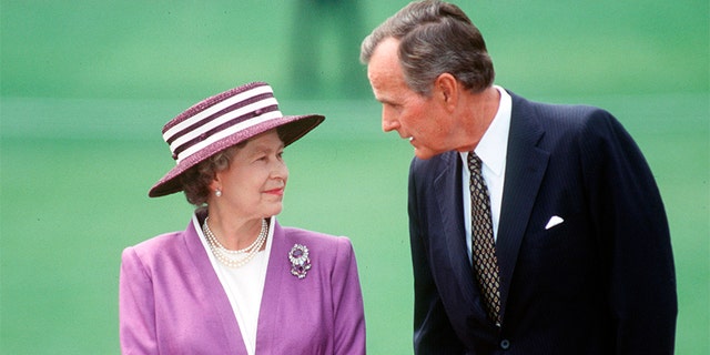 George H.W. Bush and Queen Elizabeth II. — Getty