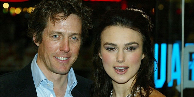 Actors Hugh Grant and Kiera Knightley attend the UK charity film premiere of "Love Actually" at The Odeon Leicester Square on November 16, 2003 in London.
