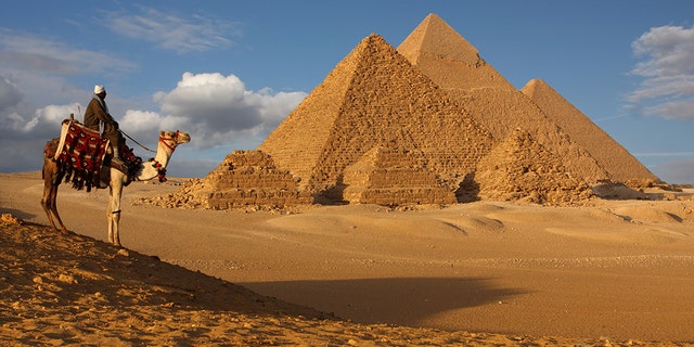 Egyptian security officials say a roadside bomb has hit a tourist bus in an area near the Giza Pyramids, killing at least two people and wounding 12 others.