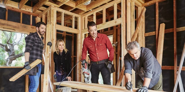 (From left to right) Drew Scott, Maureen McCormick, Jonathan Scott and Christopher Knight on the set of HGTV's upcoming series "A Very Brady Renovation."
