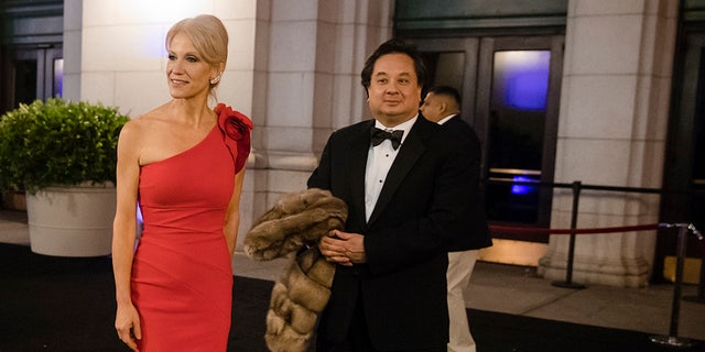 In this Thursday, Jan. 19, 2017 photo, President-elect Donald Trump adviser Kellyanne Conway, center, accompanied by her husband, George.