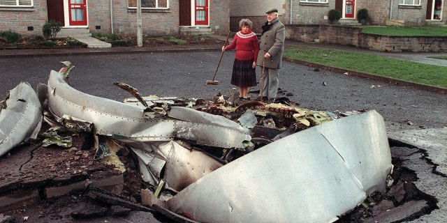 Local resident Robert Love stands by one of the four engines of the ill-fated Pan Am 747 Jumbo jet, 22 December 1988, that exploded and crashed 21 December on the route to New-York, with 259 passengers on board.