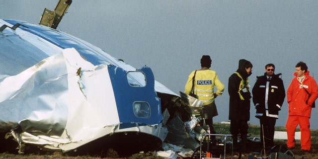 Scottish rescue workers and crash investigators search the area around the cockpit of Pan Am flight 103 in a farmer's field east of Lockerbie Scotland after a mid-air bombing killed all 259 passengers and crew, and 11 people on the ground.