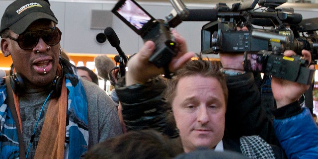 Michael Spavor is seen with former NBA star Dennis Rodman before boarding a flight in Beijing to North Korea.