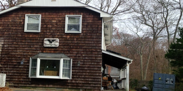 Police said DNA testing is underway if human remains found in this house in Lake Grove, L.I., are those of Korean War vet who has been missing for decades. The missing man's son found the remains.