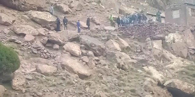 This photo provided by Moroccan News website, Marrakechalaan.com, and dated Monday, Dec. 18, 2018, shows security personnel at the scene where the bodies of two Scandinavian women tourists were found dead, near Imlil in the High Atlas mountains, Morocco.
