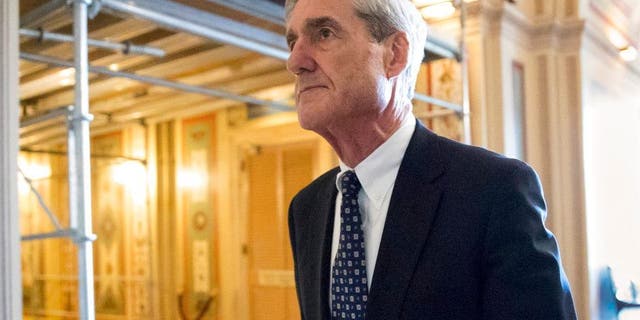 FILE - In this June 21, 2017, file photo, special counsel Robert Mueller departs after a meeting on Capitol Hill in Washington. Mueller is set to reveal more details about his Russia investigation as he faces court deadlines in the cases of two men who worked closely with President Donald Trump. (AP Photo/J. Scott Applewhite, File)