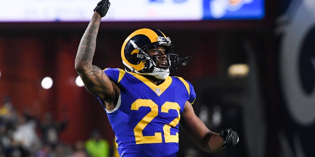 Cornerback Marcus Peters #22 of the Los Angeles Rams urges on the crowd during the fourth quarter against the Philadelphia Eagles at Los Angeles Memorial Coliseum on December 16, 2018 in Los Angeles, California.