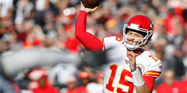 Kansas City Chiefs quarterback Patrick Mahomes (15) passes against the Oakland Raiders during the first half of an NFL football game in Oakland, Calif., Sunday, Dec. 2, 2018.