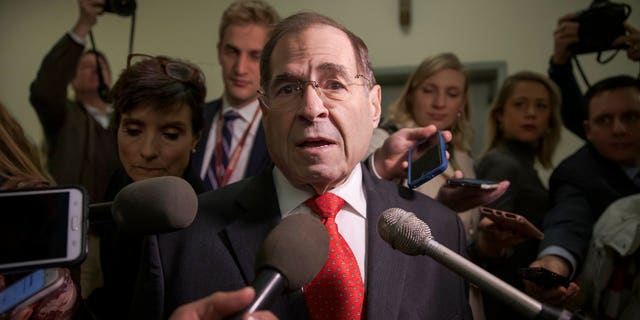 Rep. Jerrold Nadler, D-N.Y., the top Democrat on the House Judiciary Committee, is met by reporters as he arrives for testimony by former FBI Director James Comey behind closed doors on Capitol Hill in Washington, Friday, Dec. 7, 2018.