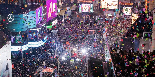 In this Jan. 1, 2017 file photo, revelers celebrate the new year as confetti flies over New York's Times Square. (AP Photo/Mary Altaffer, File)