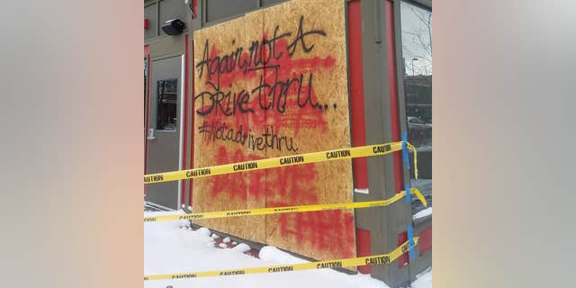 Following the second accident in November, the staff spraypainted the phrase, "Again, not a drive-thru" on the outside.