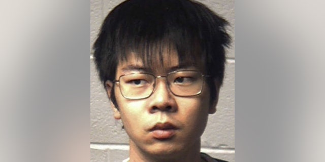 Yuaki Yang, 22, is accused of poisoning his African-American roommate, officials say.