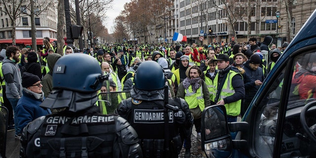 Protester on the Rue Marceau, in front of the Place de l'Etoile, during demonstration of the "Yellow Vests", in Paris, France, on December 8th 2018.