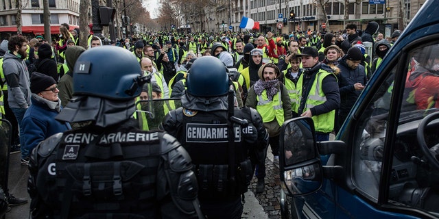 Protester on the Rue Marceau, in front of the Place de l'Etoile, during demonstration of the "Yellow Vests", in Paris, France, on December 8th 2018.