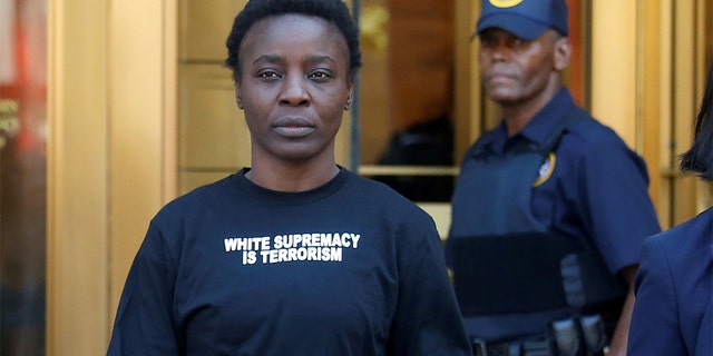 Patricia Okoumou walks out of federal court from her arraignment, a day after authorities say she scaled the stone pedestal of the Statue of Liberty to protest U.S. immigration policy, in Manhattan, New York, U.S., July 5, 2018.