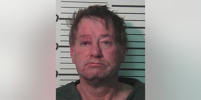 Randal Dickinson allegedly fired 16 rounds at his roommate, police say.