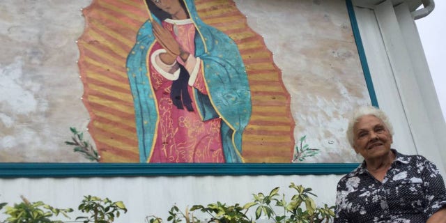 Millie Francis, 85, says she was inspired to paint a picture of the Virgin Mary on a piece of plywood that replaced a window she wanted removed from her mobile home in Bradenton, Florida.