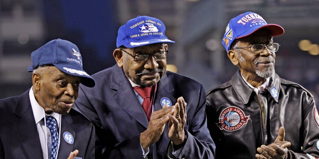 Tuskegee Airman Wilfred DeFour (far right) died from apparent natural causes at the age of 100. (AP Photo/Kathy Willens, File)