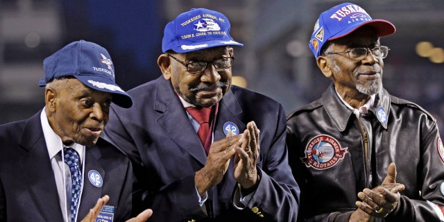 Tuskegee Airman Wilfred DeFour (far right) died from apparent natural causes at the age of 100. (AP Photo/Kathy Willens, File)